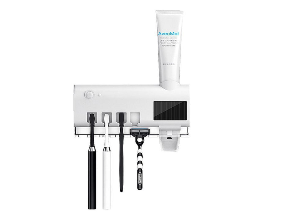 דספנסר למשחת שיניים המשלב מעמד חיטוי למברשות שיניים